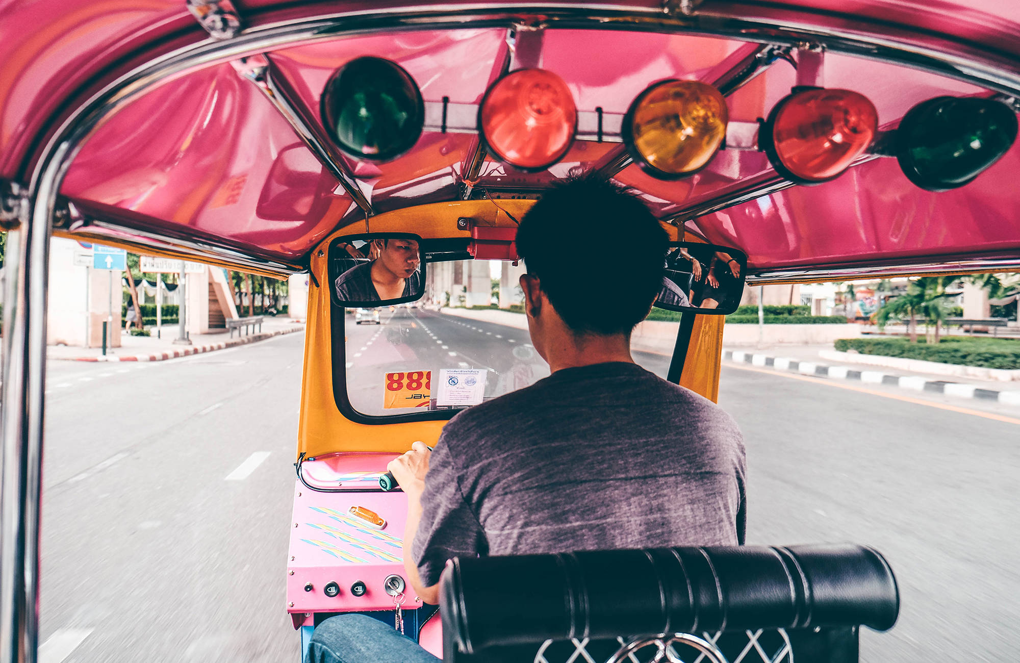bangkok-man-driving-a-rickshaw-cover