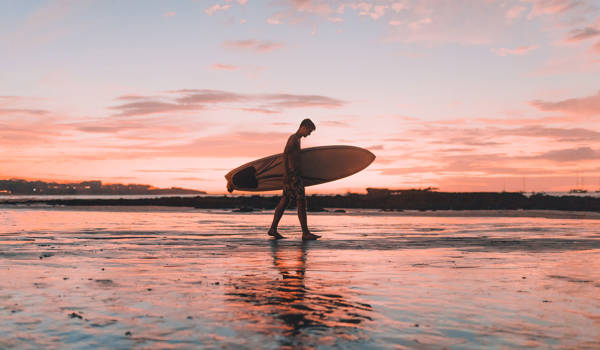 Surfer On Beach