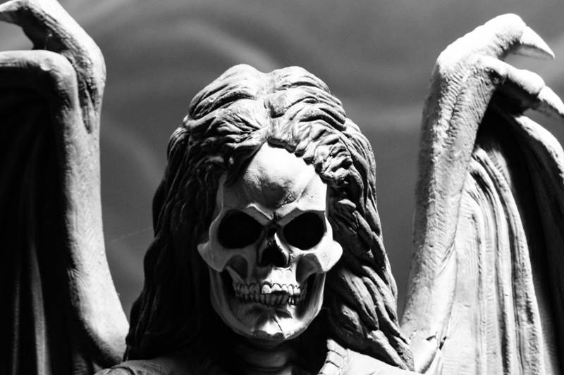 Skull-faced statue with wings during the annual Haunted Happenings festival in Salem, Massachusetts