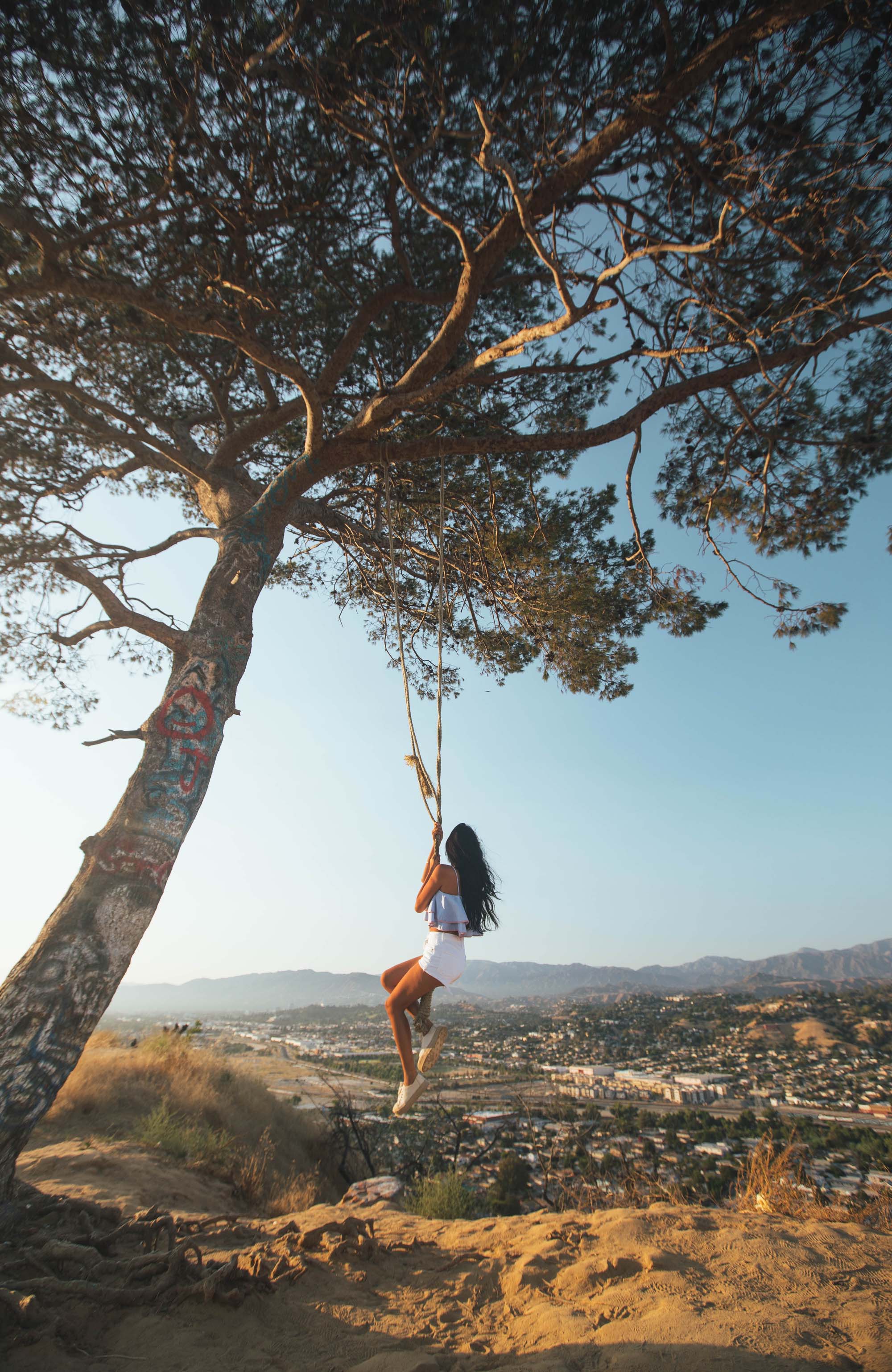 los-angeles-woman-on-swing-park-sidebar